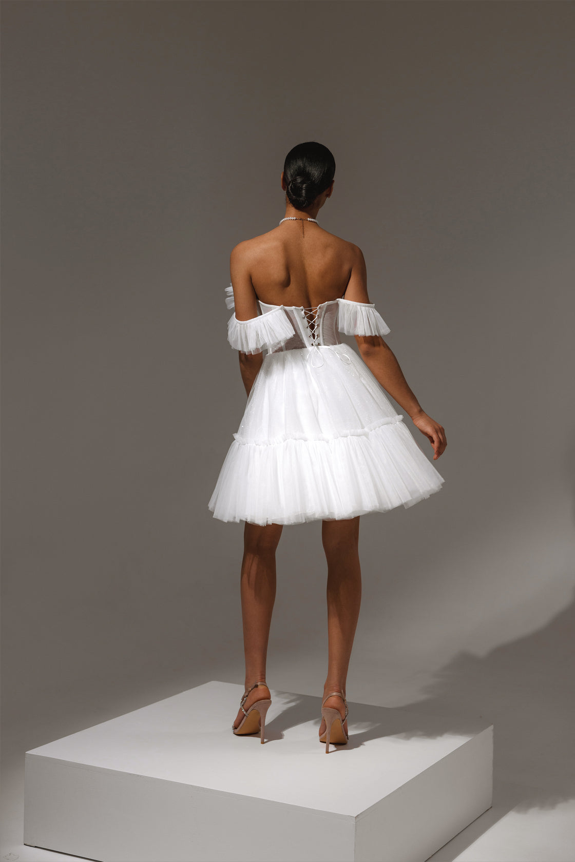 Adjustable straps and polished back detail of Alpa dress
