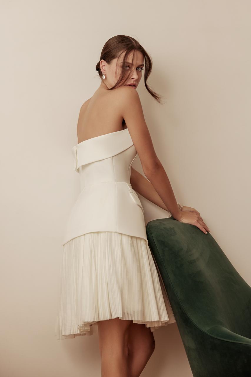 Back view showcasing Arden’s low scoop back and original design