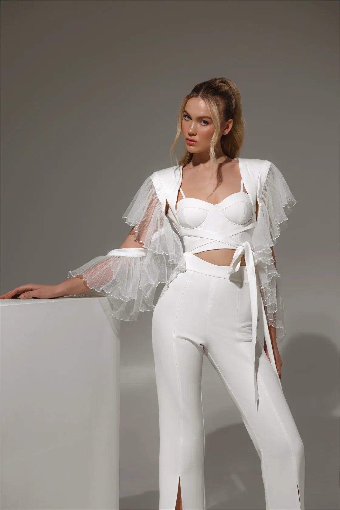 Front view of Meralis suit dress – structured shoulders and sleek silhouette