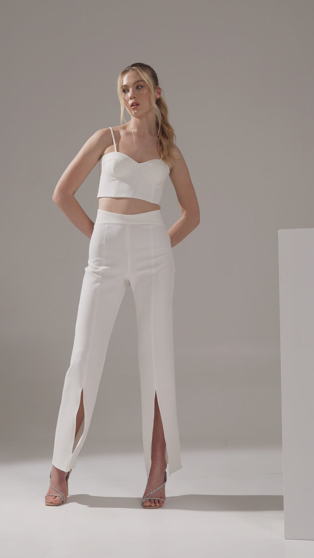 Close‑up of fabric texture and belted waist detail